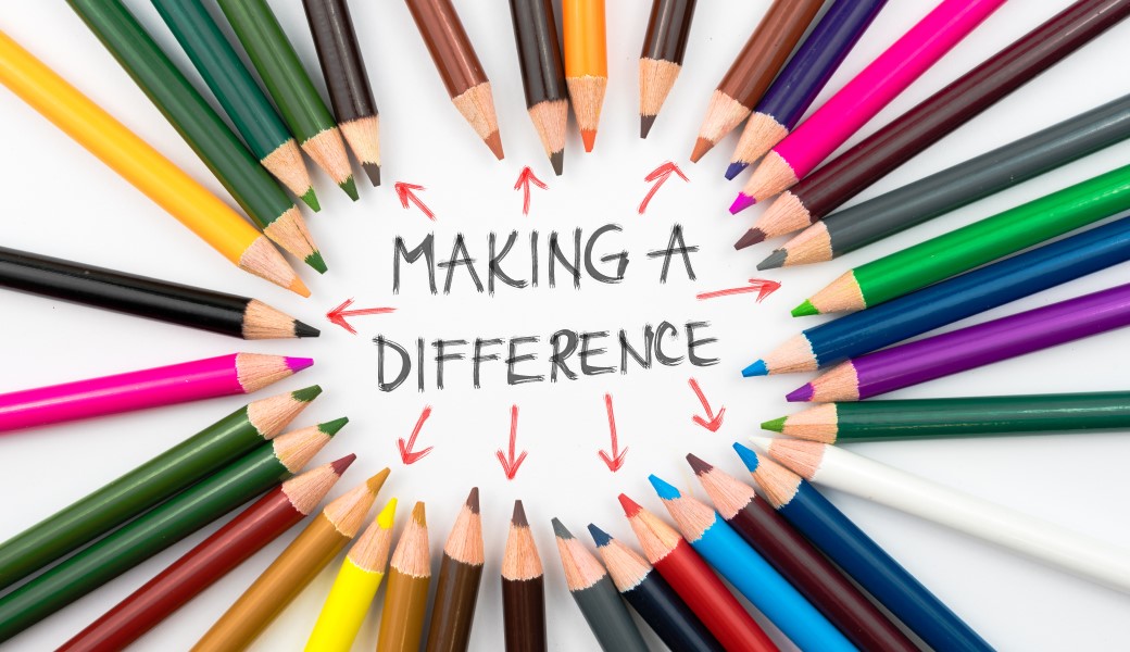 Image of colored pencils pointing to Making a Difference text